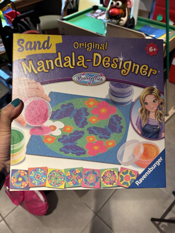 Mandala papillon sable